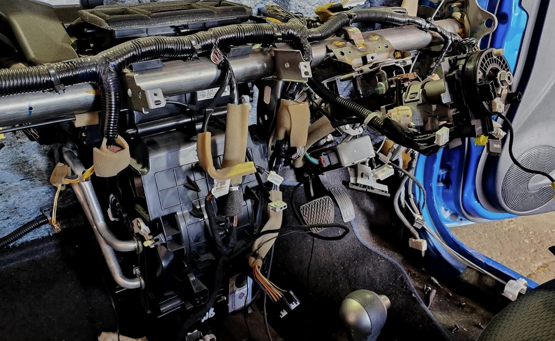 A car up on the hoist inside the MP Mechanical workshop in Edinburgh North
